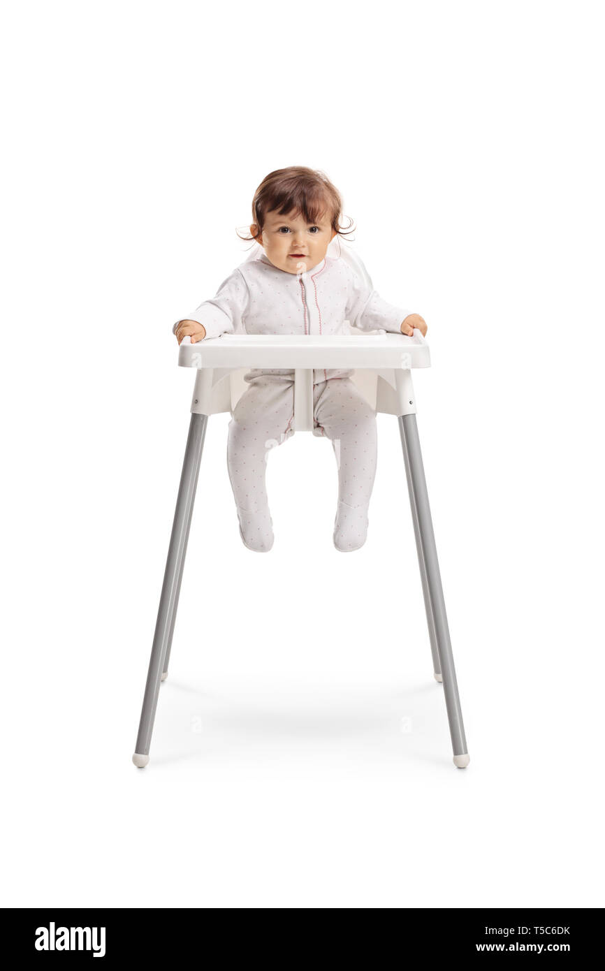 Full length portrait of a baby girl sitting in a feeding chair isolated on white background Stock Photo