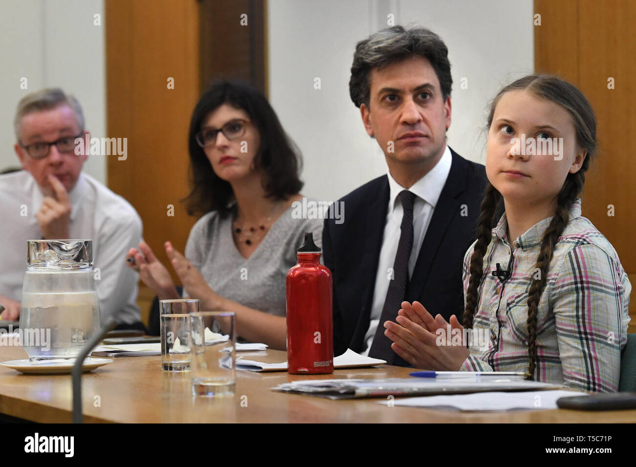 Environment Secretary Michael Gove (left), Former Labour leader Ed Miliband (2nd right) and Swedish climate activist Greta Thunberg (right) at the House of Commons in Westminster, London, to discuss the need for cross-party action to address the climate crisis. Stock Photo