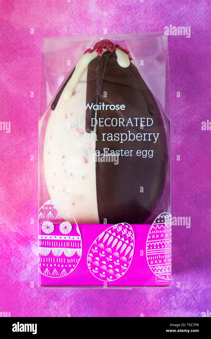 Waitrose hand decorated Scottish raspberry chocolate Easter Egg - an indulgent white and dark chocolate egg with freeze dried raspberry pieces Stock Photo