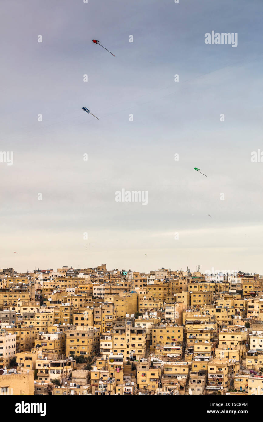Amman, Jordan. View from the citadel on the housing complex of the old city. Typical kites fly in the sky Stock Photo -