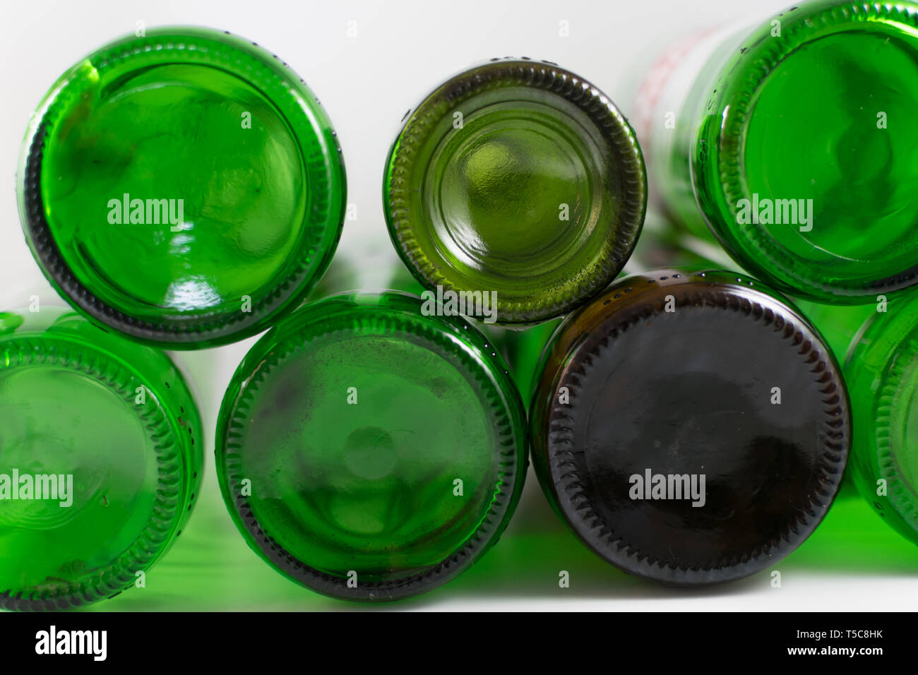 Pack of empty beer and wine green and brown glass bottom bottles, on a
