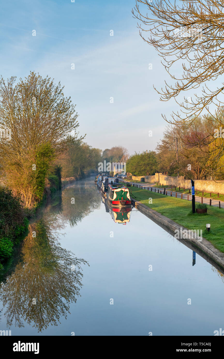 Canal boats on the oxford canal in the early morning spring sunlight