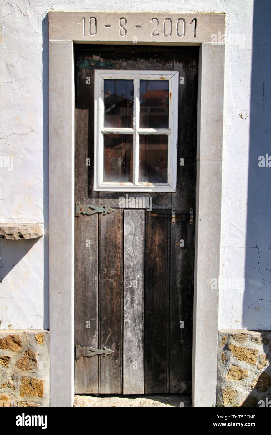 Old And Colorful Wooden Door With Iron Details In Lisbon