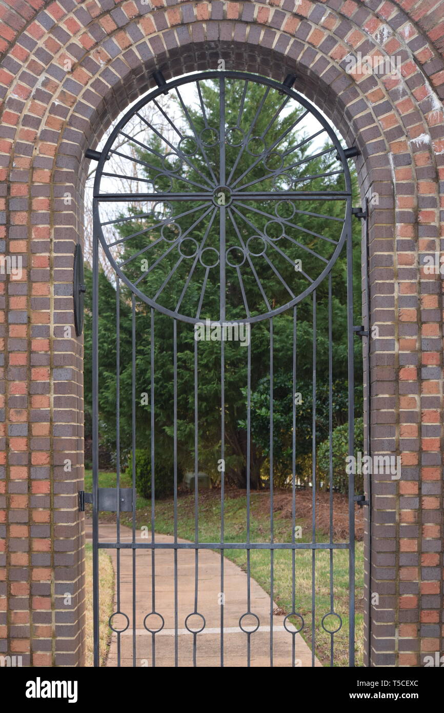 Brick door with iron steel circle with iron steel bars Stock Photo