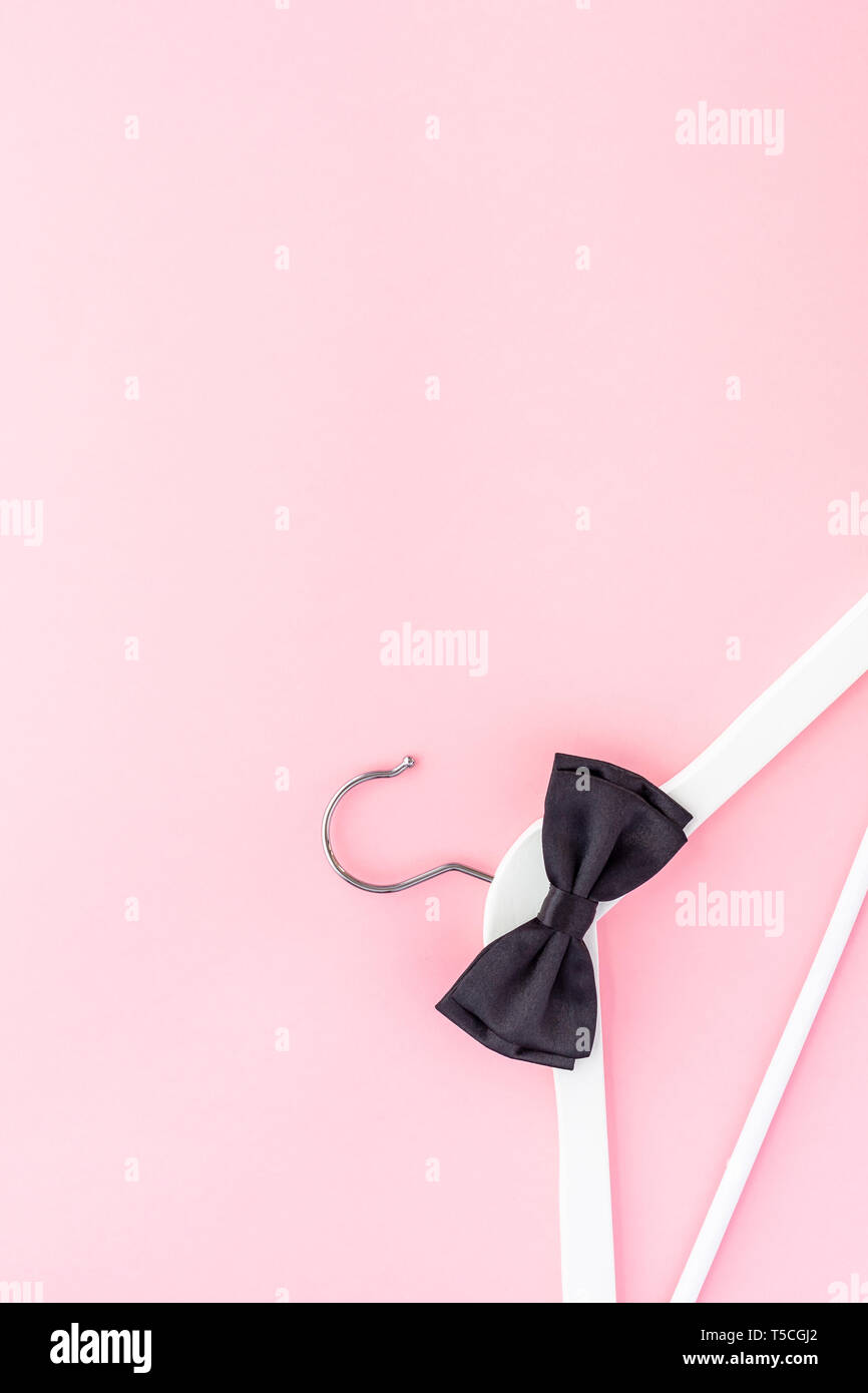Creative top view flat lay white wooden hangers pastel millennial pink ...