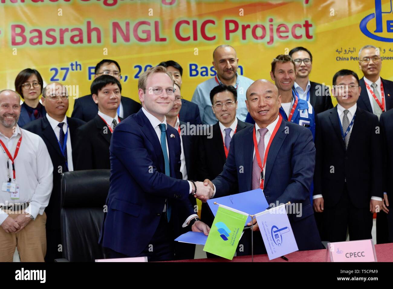 (190423) -- BASRA (IRAQ), April 23, 2019 (Xinhua) -- Photo taken on Feb. 27, 2019 shows officials from Basrah Gas Company and China Petroleum Engineering and Construction Corporation (CPECC) attending a ceremony to sign cooperation agreement in the southern province of Basra, Iraq. Through the Belt and Road Initiative, the Chinese company can offer financial, technical support and expertise for Iraqi government in reconstructing oil fields and increase their production, said Wang Xianghui, project director of Rumaila in China Petroleum Engineering and Construction Corporation (CPECC). (Xinhua/ Stock Photo