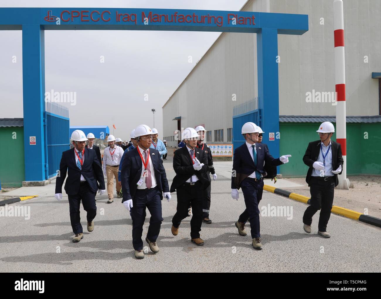 Basra, Iraq. 23rd Apr, 2019. Photo taken on Feb. 27, 2019 shows officials from China Petroleum Engineering and Construction Corporation (CPECC) and Basrah Gas Company inspecting the plant in the southern province of Basra, Iraq. Through the Belt and Road Initiative, the Chinese company can offer financial, technical support and expertise for Iraqi government in reconstructing oil fields and increase their production, said Wang Xianghui, project director of Rumaila in China Petroleum Engineering and Construction Corporation (CPECC). Credit: Khalil Dawood/Xinhua/Alamy Live News Stock Photo