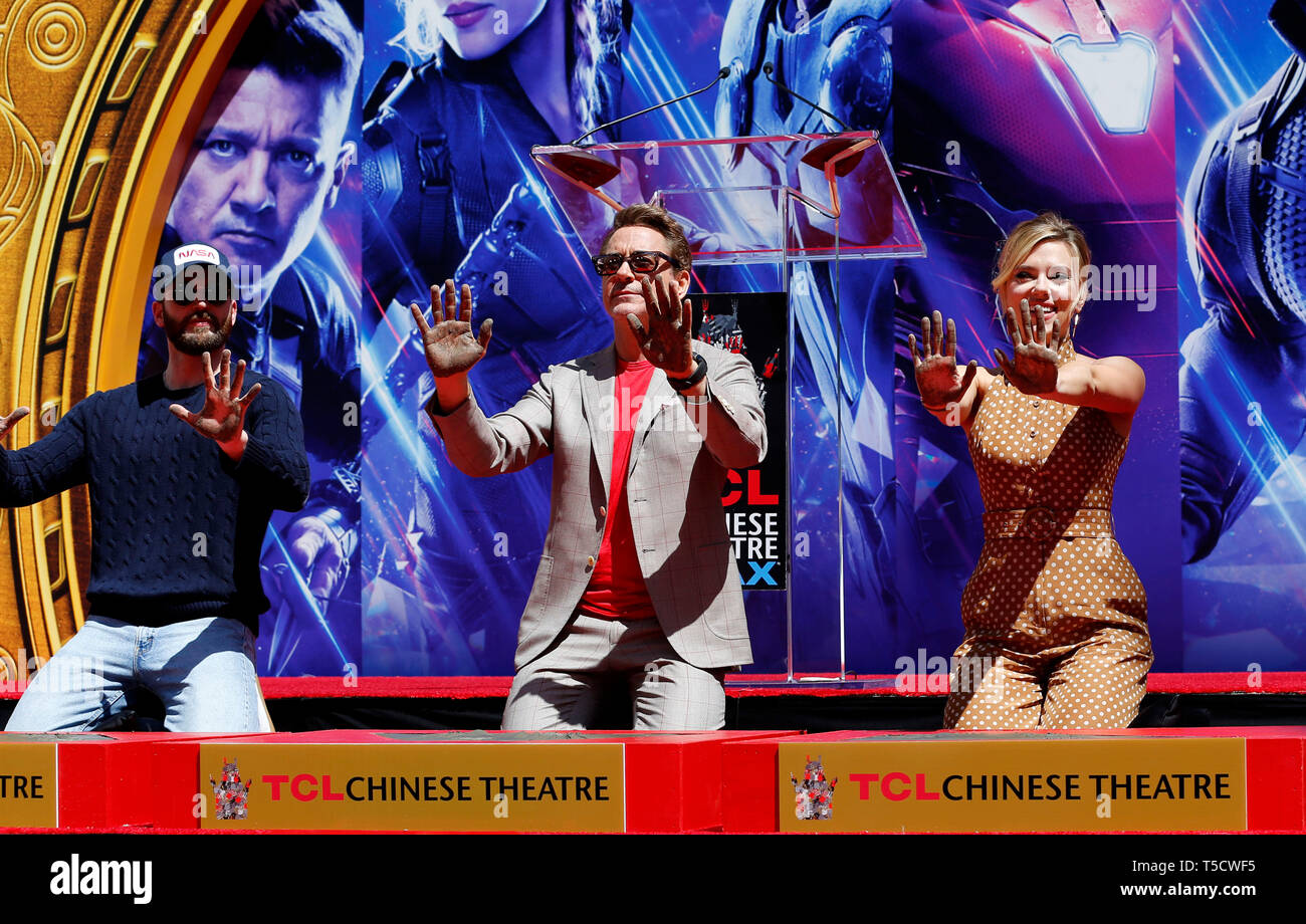 (190424) -- LOS ANGELES, April 24, 2019 (Xinhua) -- Actor Robert Downey Jr. (C), Chris Evans (L) and actress Scarlett Johansson show their hands after putting their handprints in cement during print ceremony in the forecourt of the TCL Chinese Theater in Los Angeles, the United States, April 23, 2019. The cast of Marvel Studios 'Avengers: Endgame' including Robert Downey Jr., Chris Evans, Mark Ruffalo, Chris Hemsworth, Scarlett Johansson, and Jeremy Renner, along with Marvel Studios President Kevin Feige, received one of Hollywood's oldest accolades this Tuesday, to sign their names and put t Stock Photo
