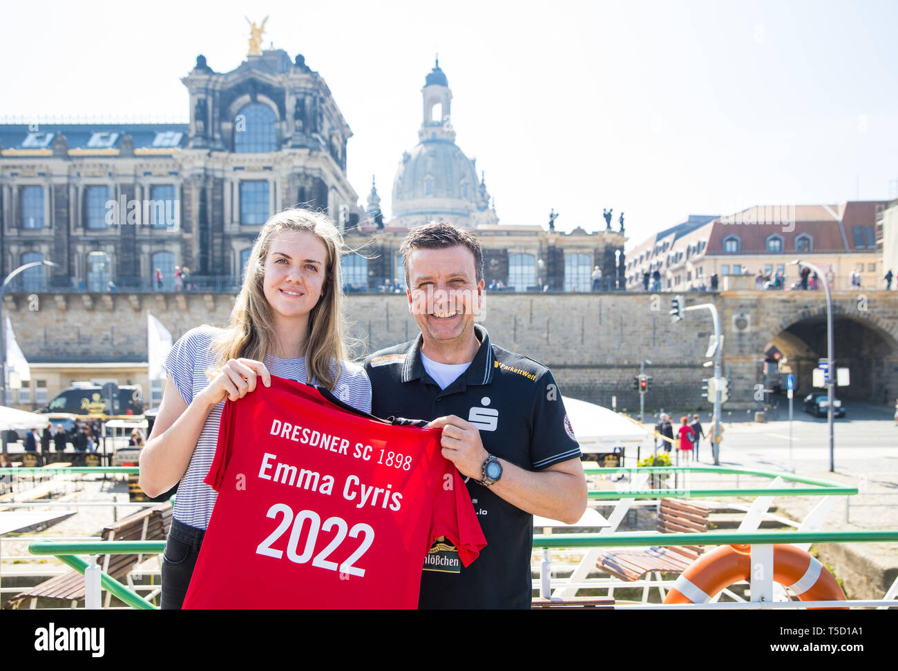 Dresden, Germany. 24th Apr, 2019. Emma Cyris, new outside attacker of the volleyball Bundesliga team Dresdner SC, and Alexander Waibl, head coach, pose with a jersey at a press conference. Credit: Oliver Killig/dpa-Zentralbild/dpa/Alamy Live News Stock Photo