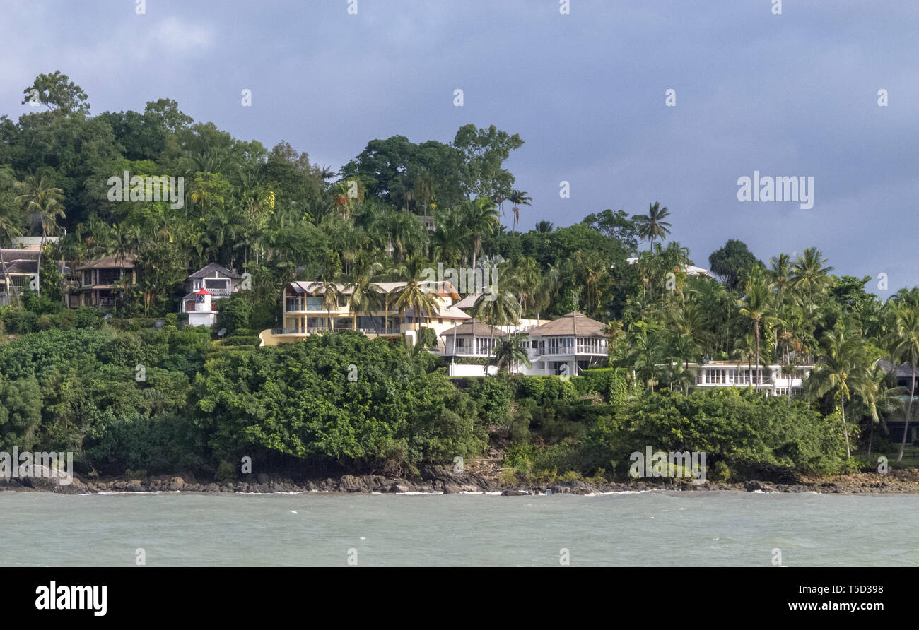 Houses and lighthouse at entry to Port Douglas, Queensland, Australia Stock Photo