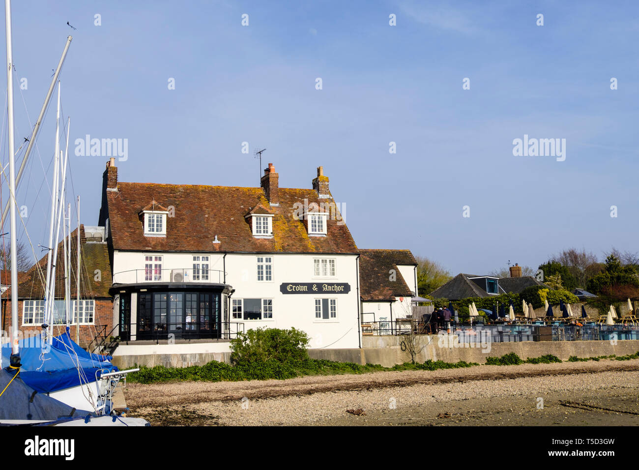 The Crown and Anchor pub on Chichester harbour waterfront. Dell Quay, West Sussex, England, UK, Britain Stock Photo