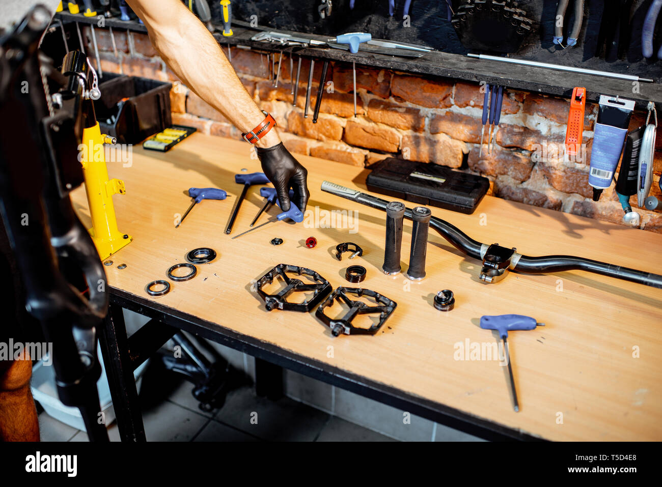 Working Place With Bicycle Parts And Working Tools On The Table Of