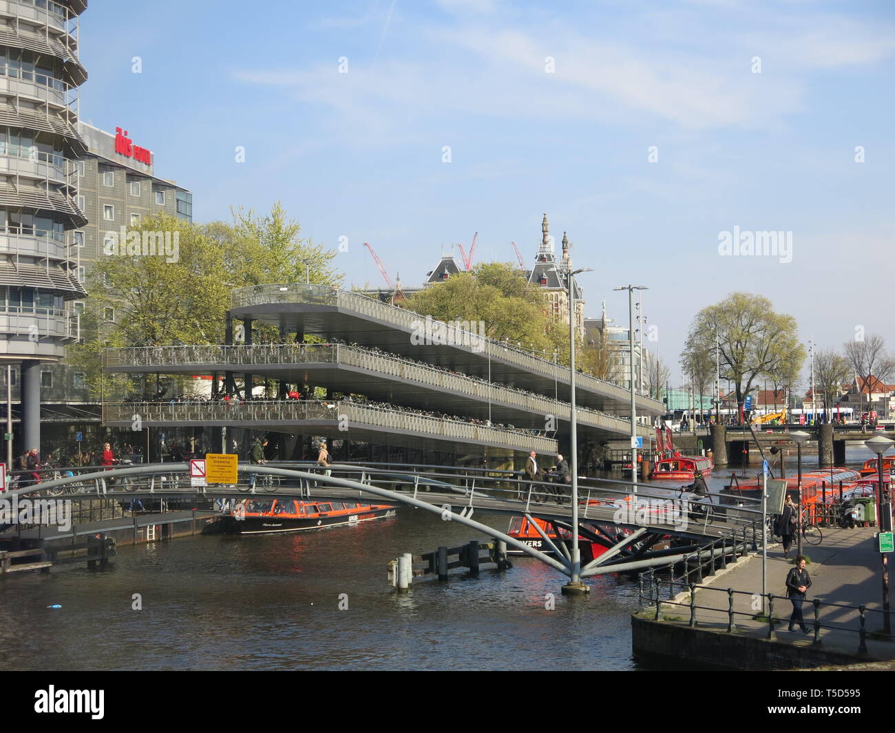 The multi-storey parking available for cyclists who wish to leave their bikes and catch the train to commute to work; Dutch transport infrastructure Stock Photo