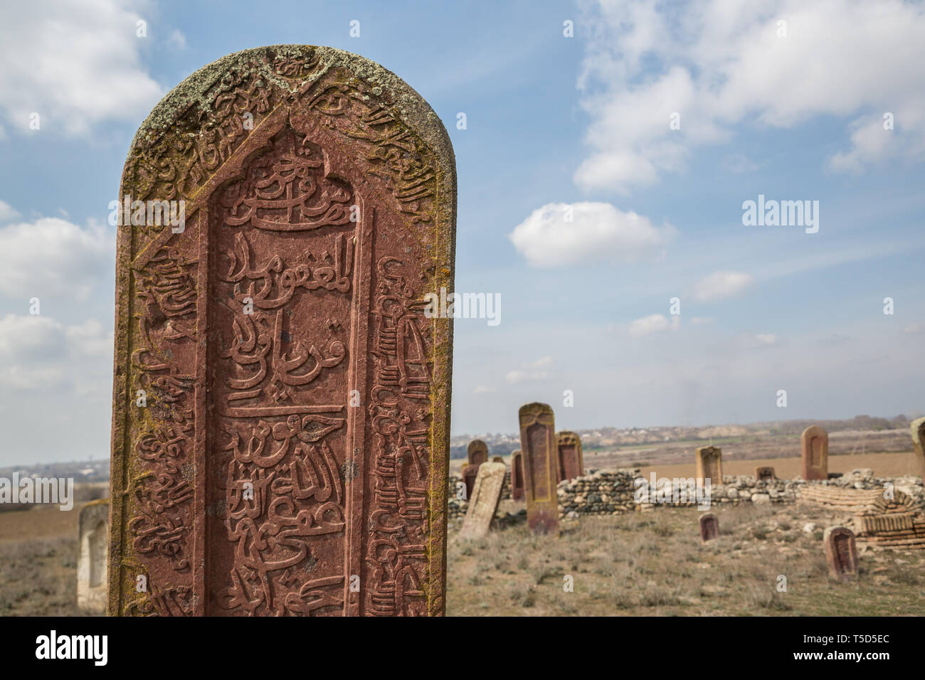 Ancient muslim cemetery near Agstafa, Azerbaijan with writings on farsi for graphic and web design, for website or mobile app. Stock Photo