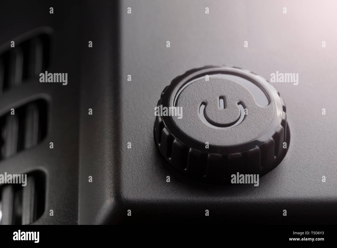 Black plastic power on off button with power adjustment. The concept of ...