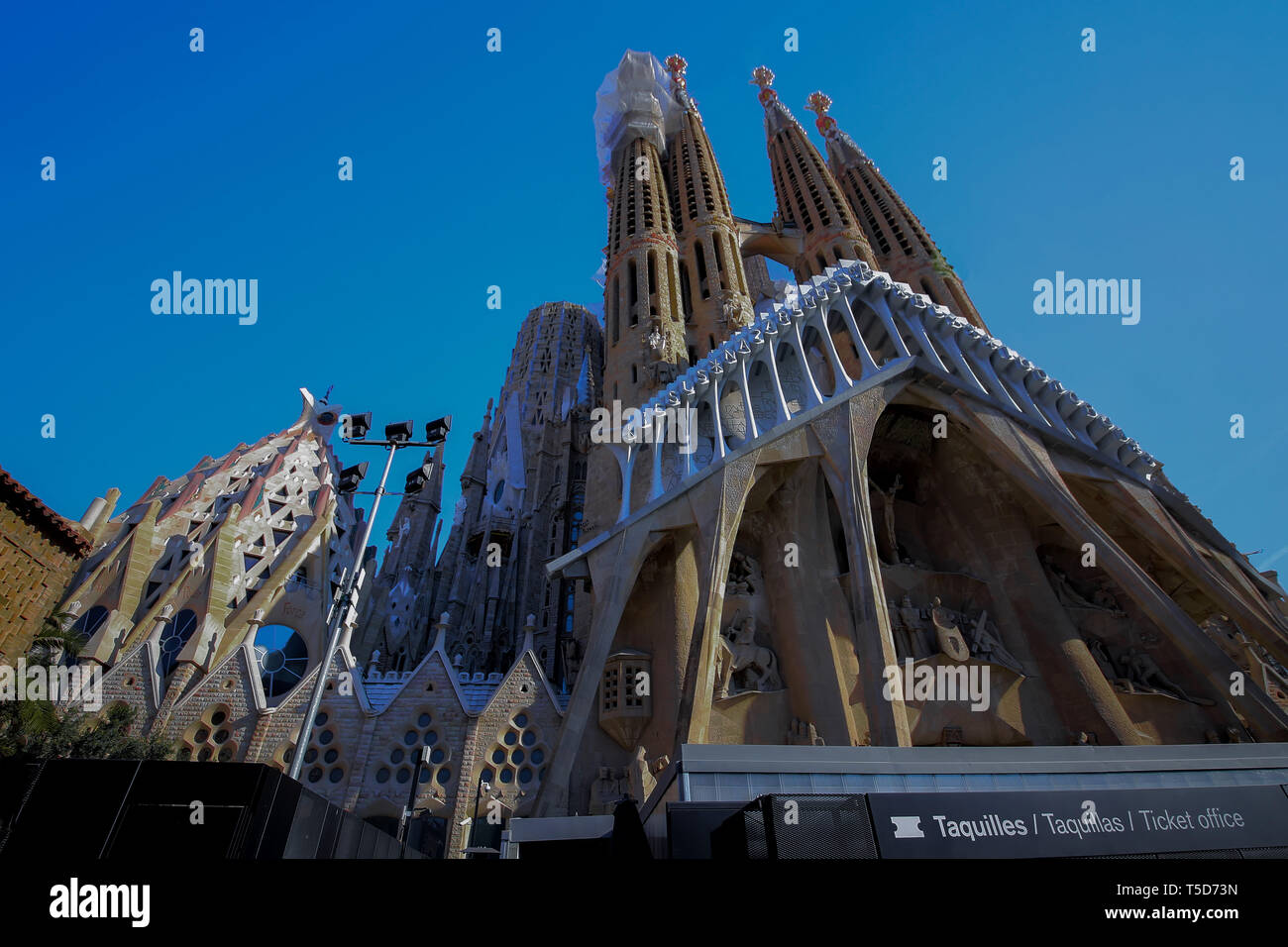 Barcelona, Spain. November 14, 2017. Entrance to the Sagrada Family by Gaudi, Basilica in sunny day, no people, against the sky, no clouds, close-up Stock Photo