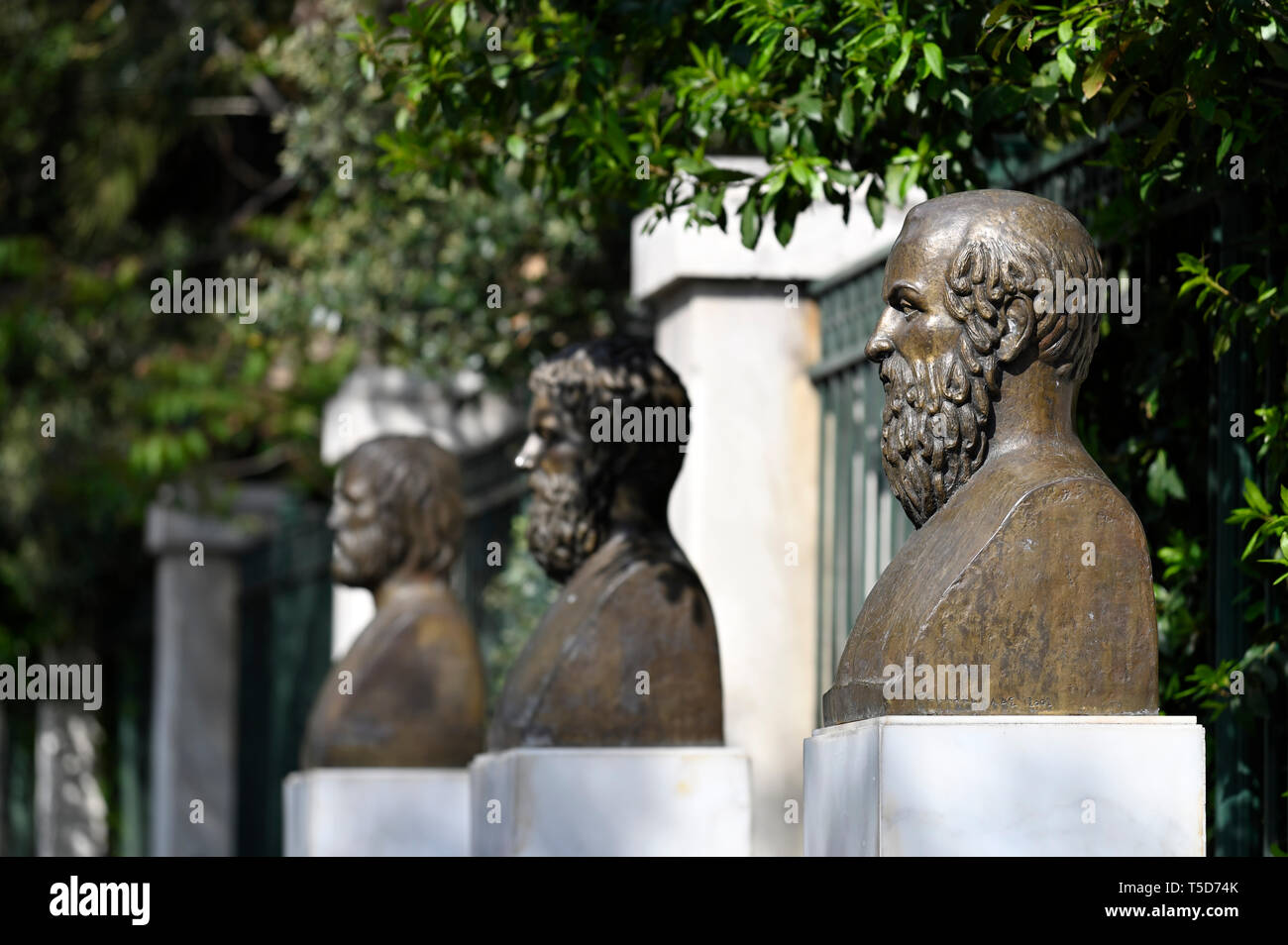 Statues of Aeschylus, Sophocles and Euripides in front of National Garden in Athens, Greece Stock Photo