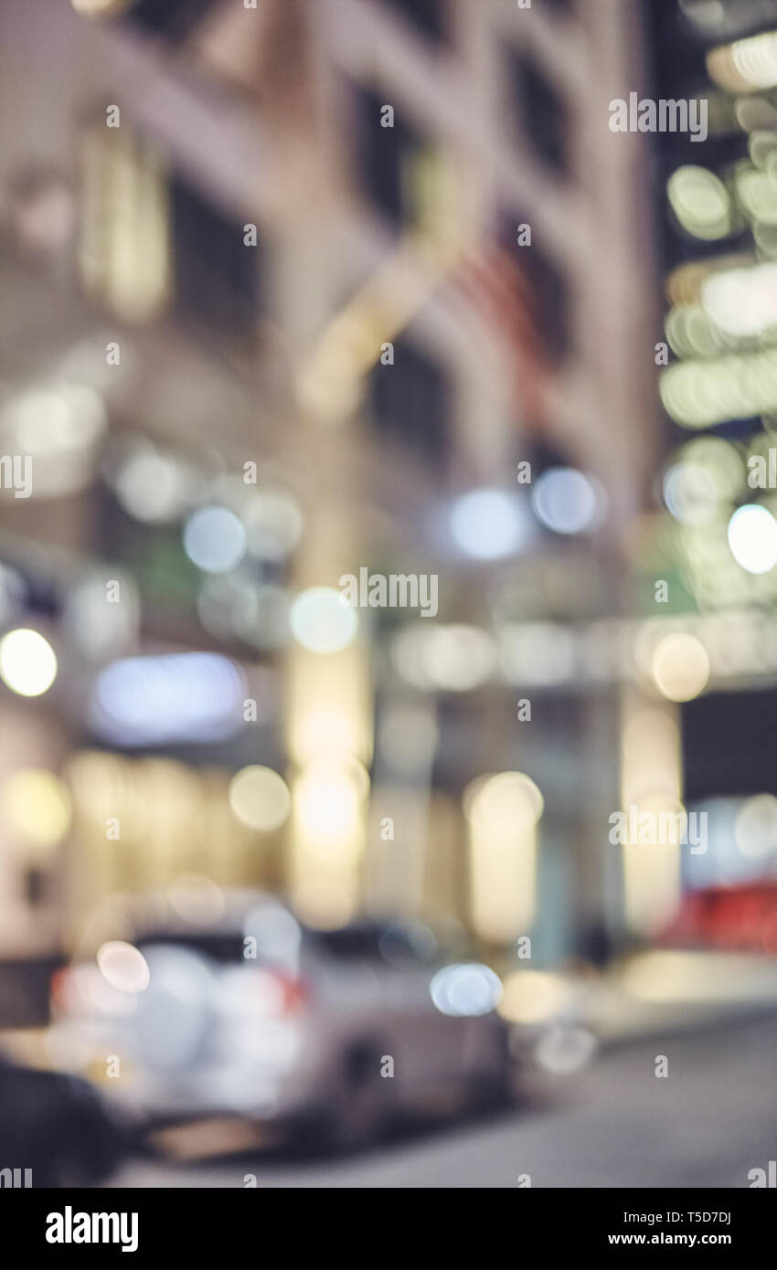 Blurred New York city street at night, color toned urban abstract ...