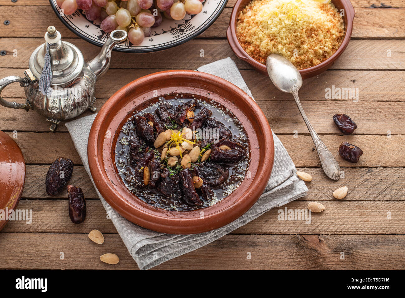 Moroccan tajine of beef with dates and almongs Stock Photo Alamy