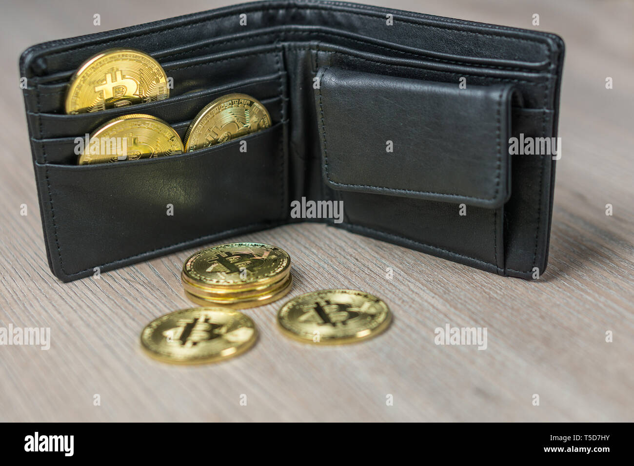 Metal bitcoins in black leather wallet. Bitcoin - modern virtual Stock  Photo - Alamy