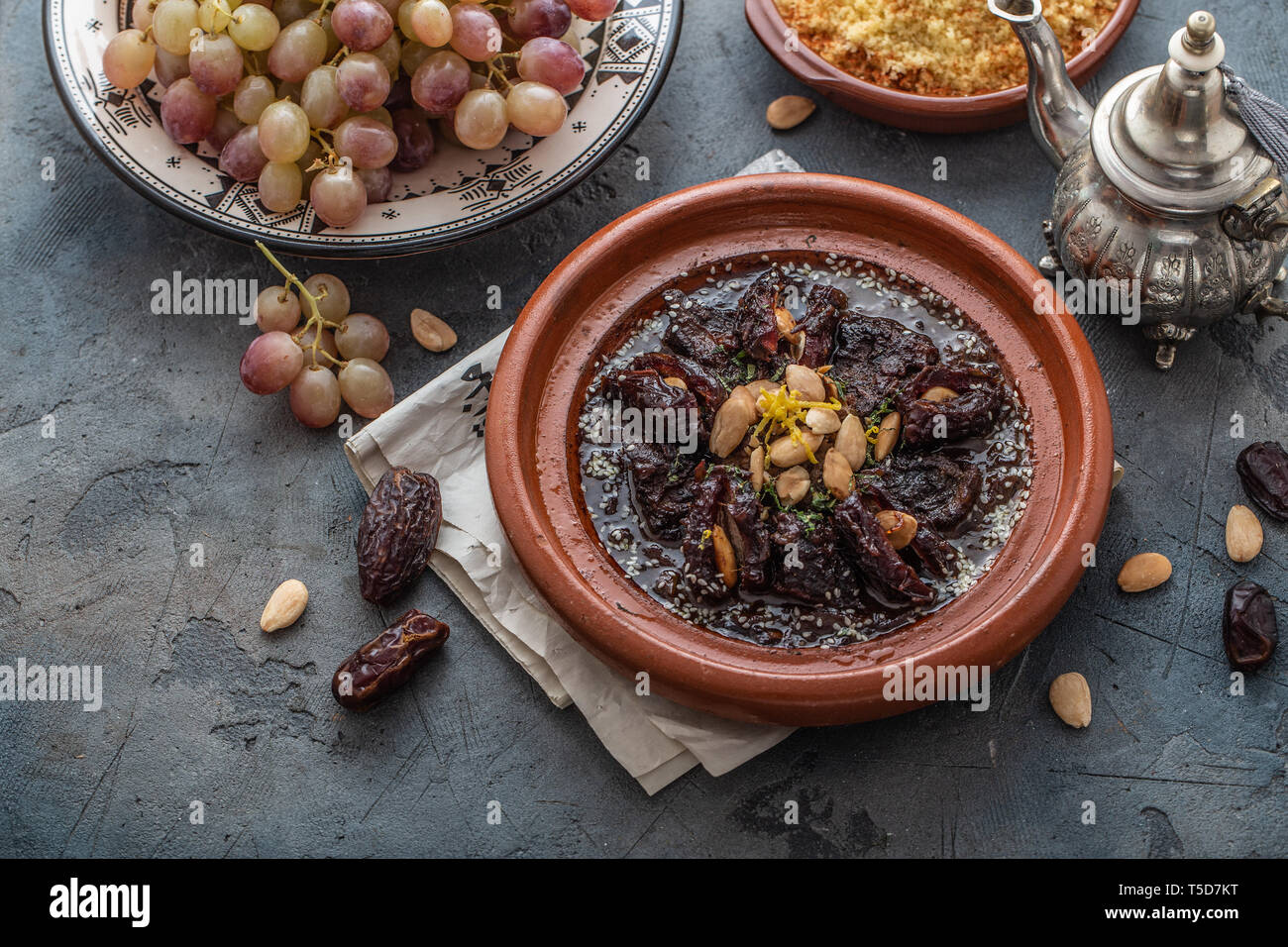 Slow cooked beef tajine with dates, raisins and almonds moroccan