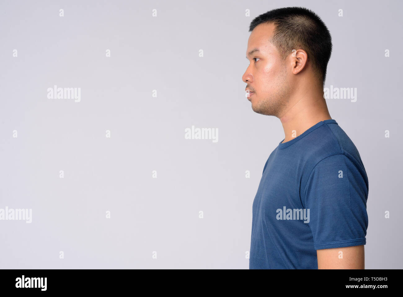 Profile View Of Young Asian Man With Short Hair Stock Photo