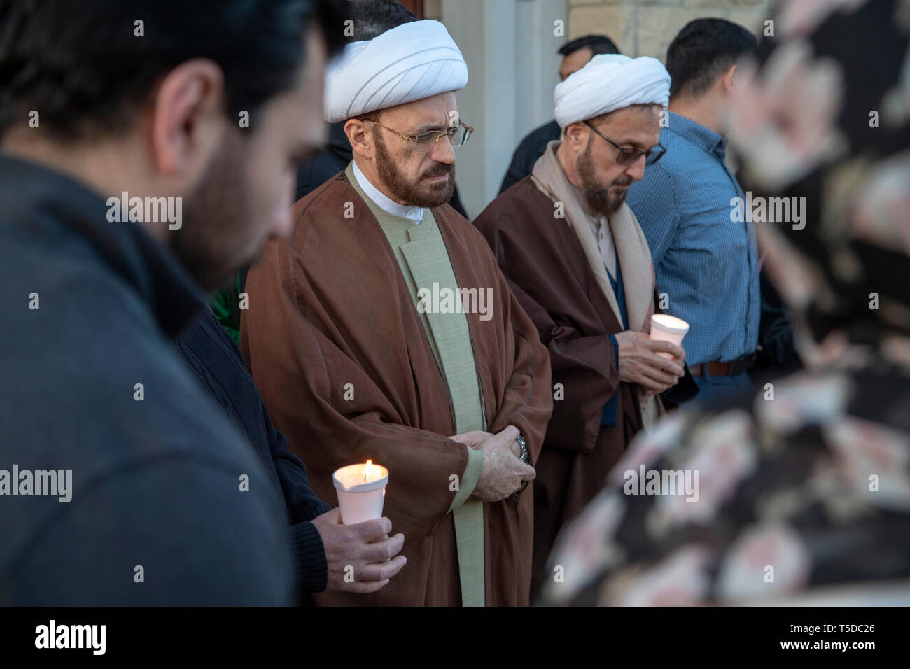 Dearborn, Michigan - Imam Mohammad Ali Elahi (left) and Imam Ibrahim Kazerooni participate in a candlelight prayer vigil at the Islamic Center of Amer Stock Photo