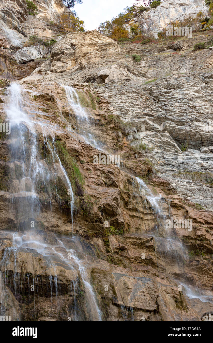 Putorana Plateau, a waterfall on the Grayling Stream. Mountain stream on a  cloudy day Stock Photo - Alamy