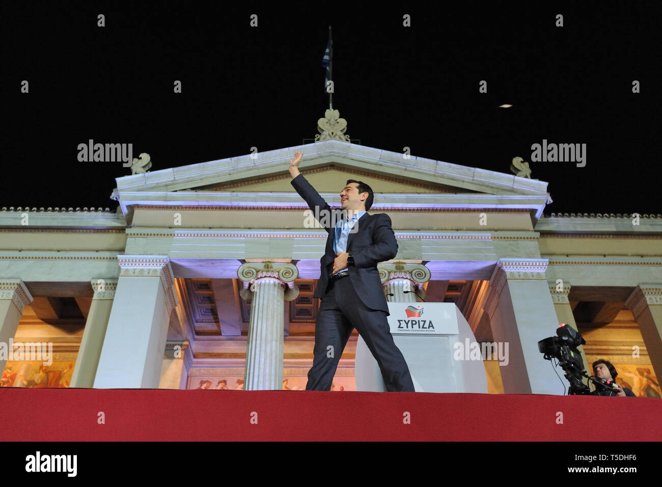 Athens, Greece. 25th Jan 2015. Alexis Tsipras waves at supporters celebrating the election victory of SYRIZA  in Athens, Greece. Credit: Nicolas Koutsokostas/Alamy Stock Photo. Stock Photo