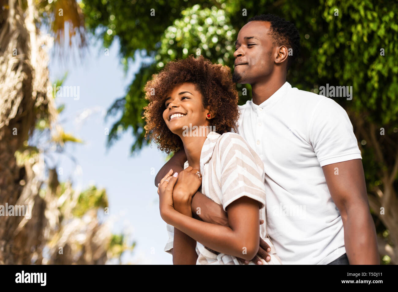 Outdoor protrait of black african american couple embracing each other ...