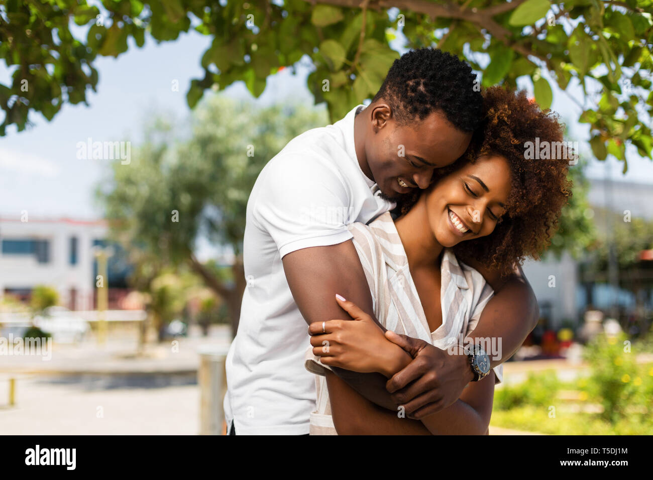 Outdoor protrait of black african american couple embracing each other ...