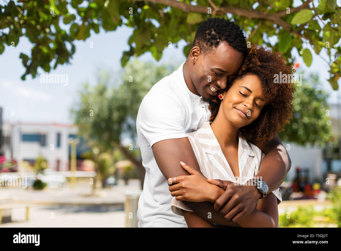 Outdoor protrait of black african american couple embracing each other ...