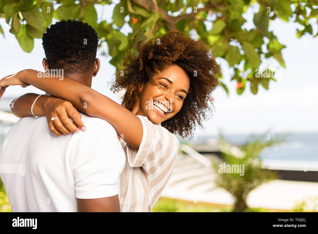 Outdoor protrait of black african american couple embracing each other ...