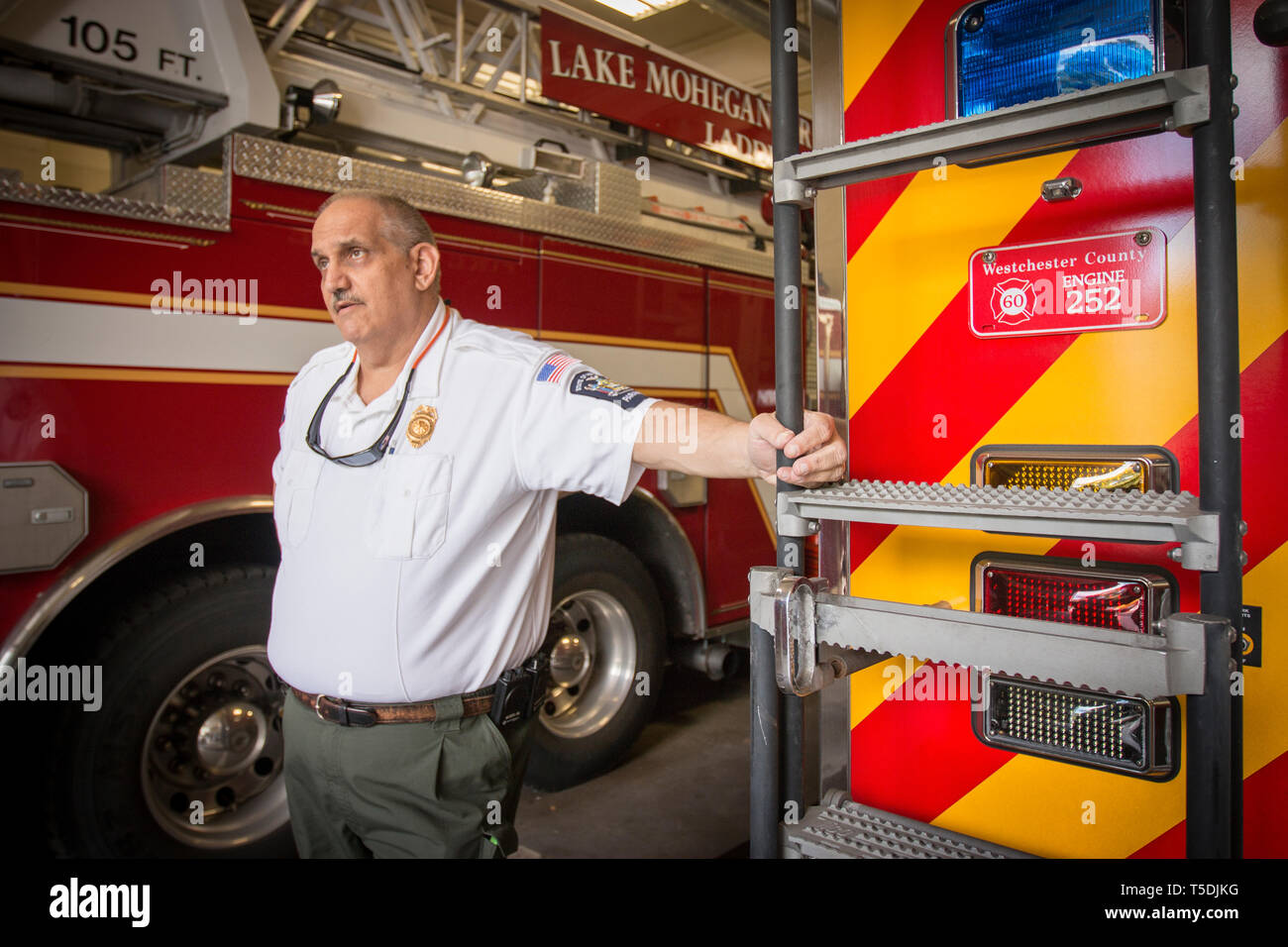Assisting Chief Barry Brown at the Yorktown Fire Department. First responders are fighting the ongoing heroin epidemy on the US east coast. Stock Photo