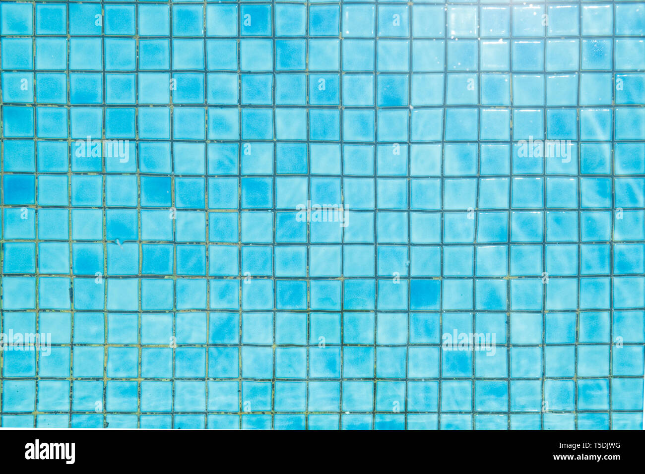 Blue ceramic tile mosaic in swimming pool - texture and background . Stock Photo