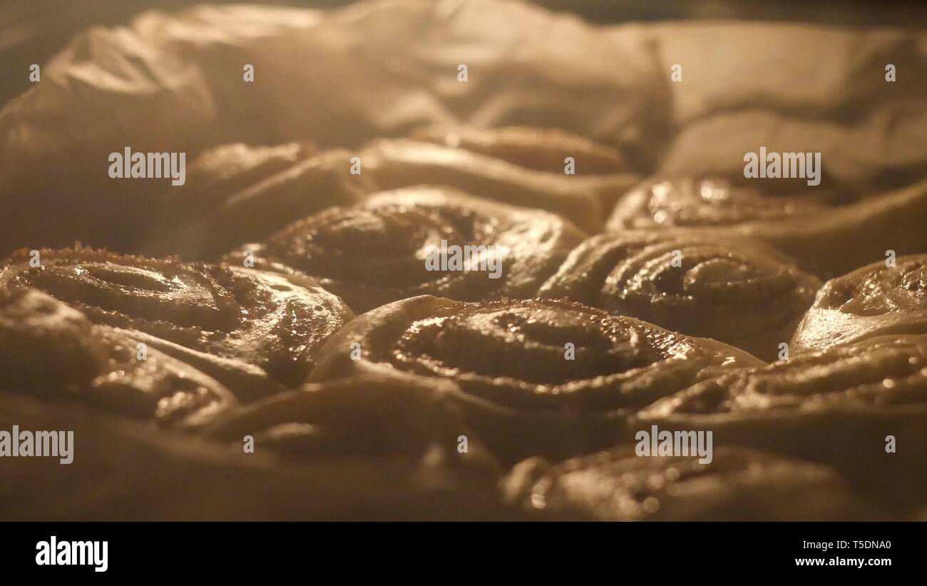 Selective focus shot of cinnabon baking, time-lapse Stock Photo