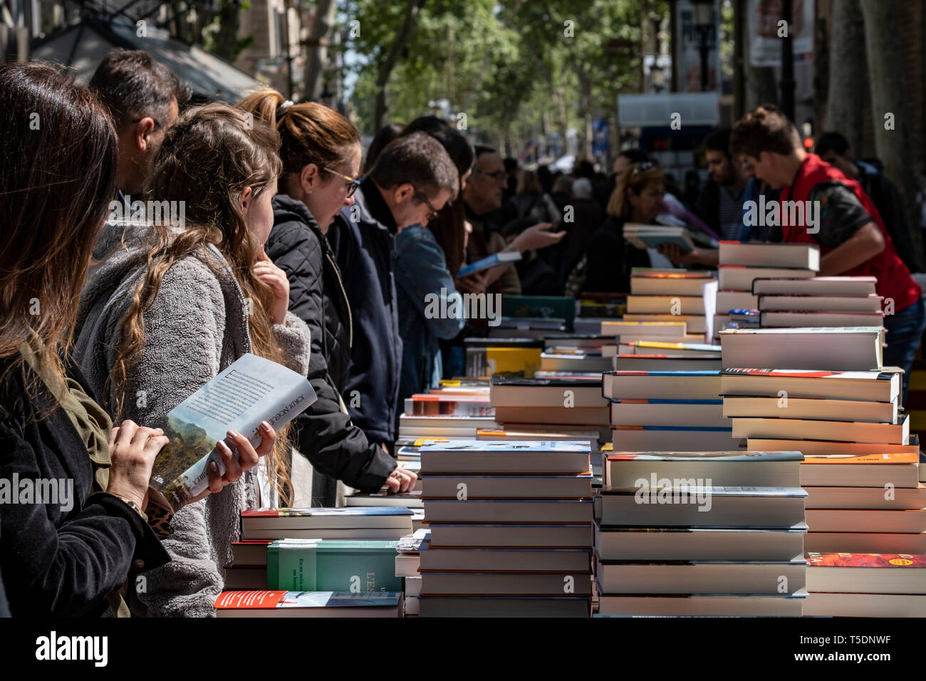 One of the stalls with books seen during the Sant Jordi day celebration.  The festivity of Sant Jordi is celebrated in conjunction with Book Day and  the Fair of Roses, symbols of