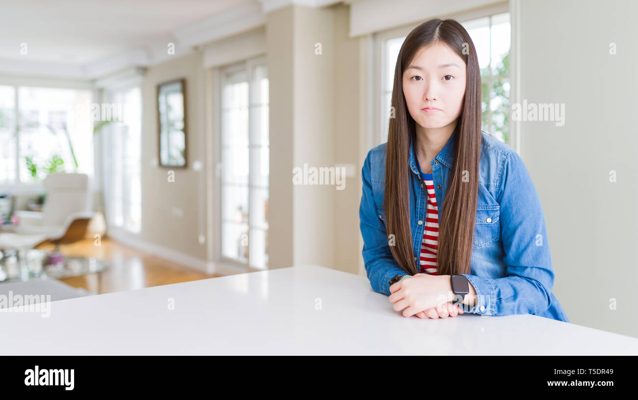 Young Beautiful Asian Woman With Long Hair Wearing Denim Jacket