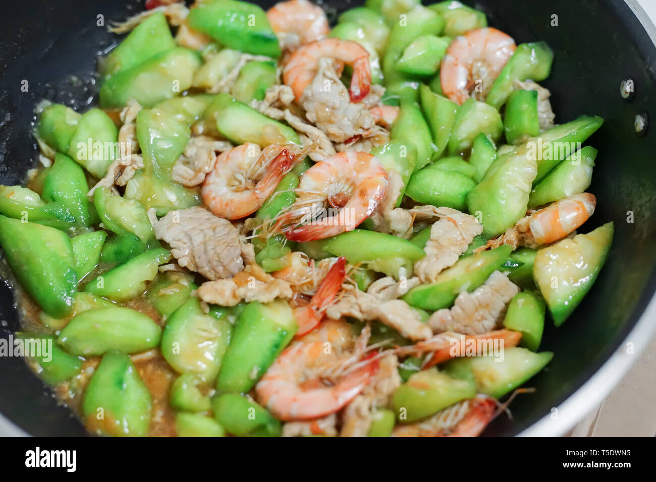 Thai menu stir fried Angled loofah with shrimp and pork. Stock Photo