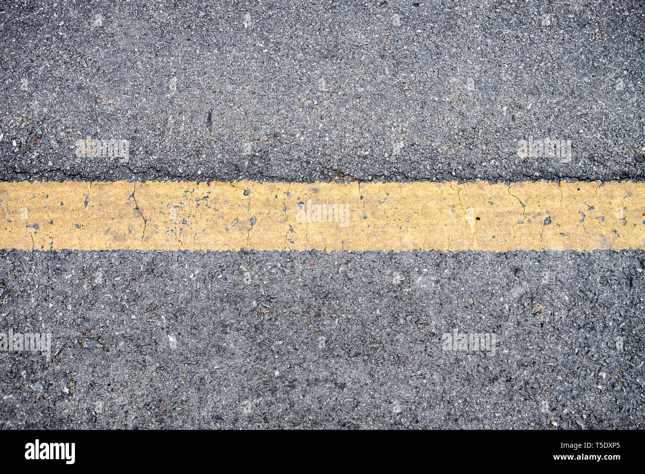 Yellow line on asphalt road texture background Stock Photo - Alamy