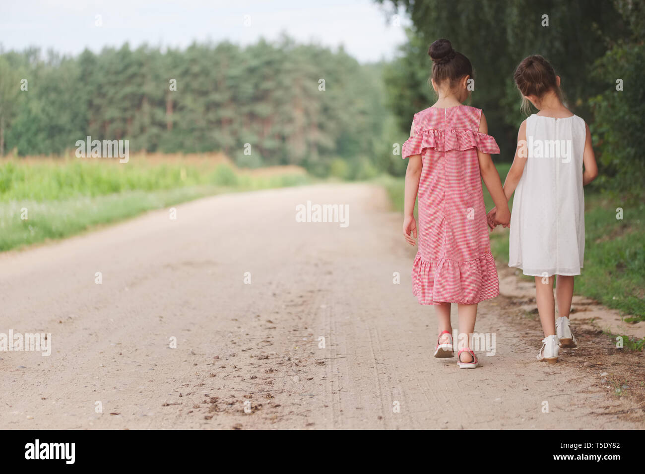two best friends playing in summer park Stock Photo - Alamy