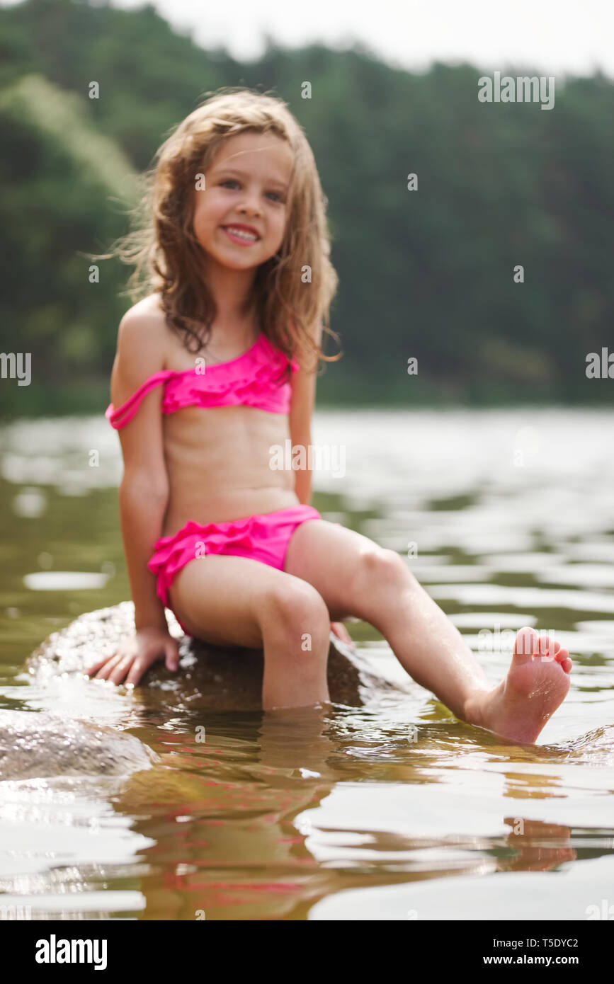 nn girls portrait of cute little girls in sumer lake Stock Photo - Alamy