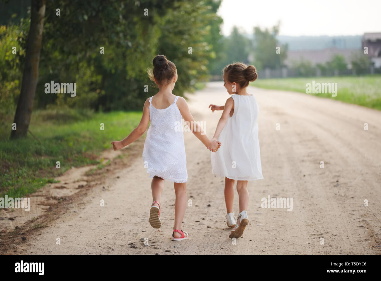 two best friends playing in summer park Stock Photo - Alamy