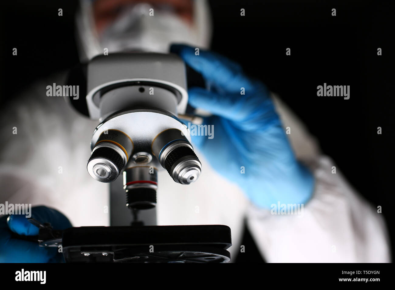 Laboratory Pharmacist Work at Optical Microscope Stock Photo