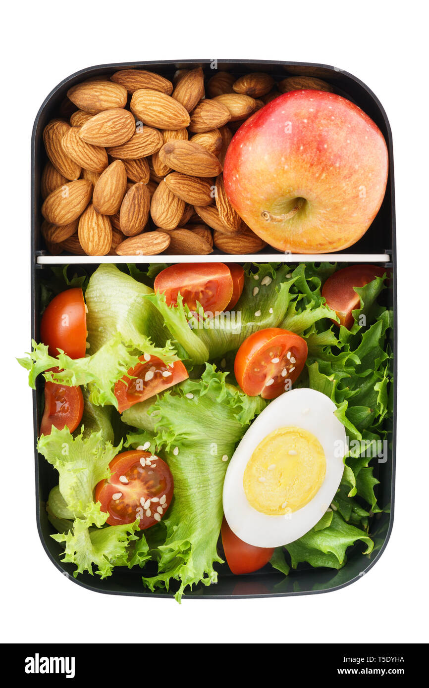 Healthy vegetarian lunch box with salad, nuts and apple. Food delivery