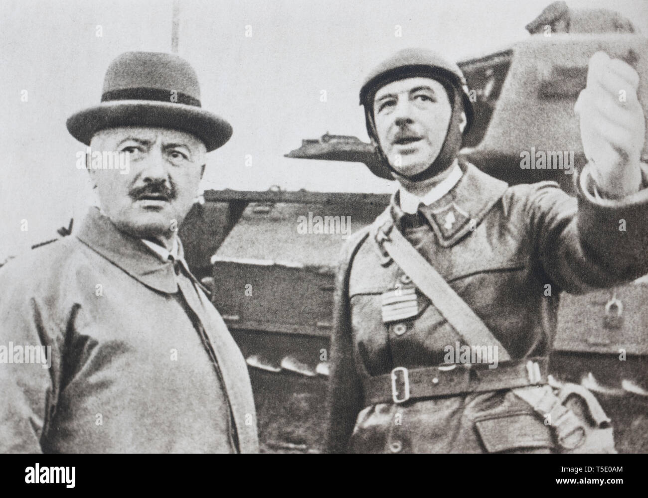 The President of the French Republic visiting army. Colonel Charles de Gaulle explains tank tactics to President Albert Lebrun (the last president of  Stock Photo