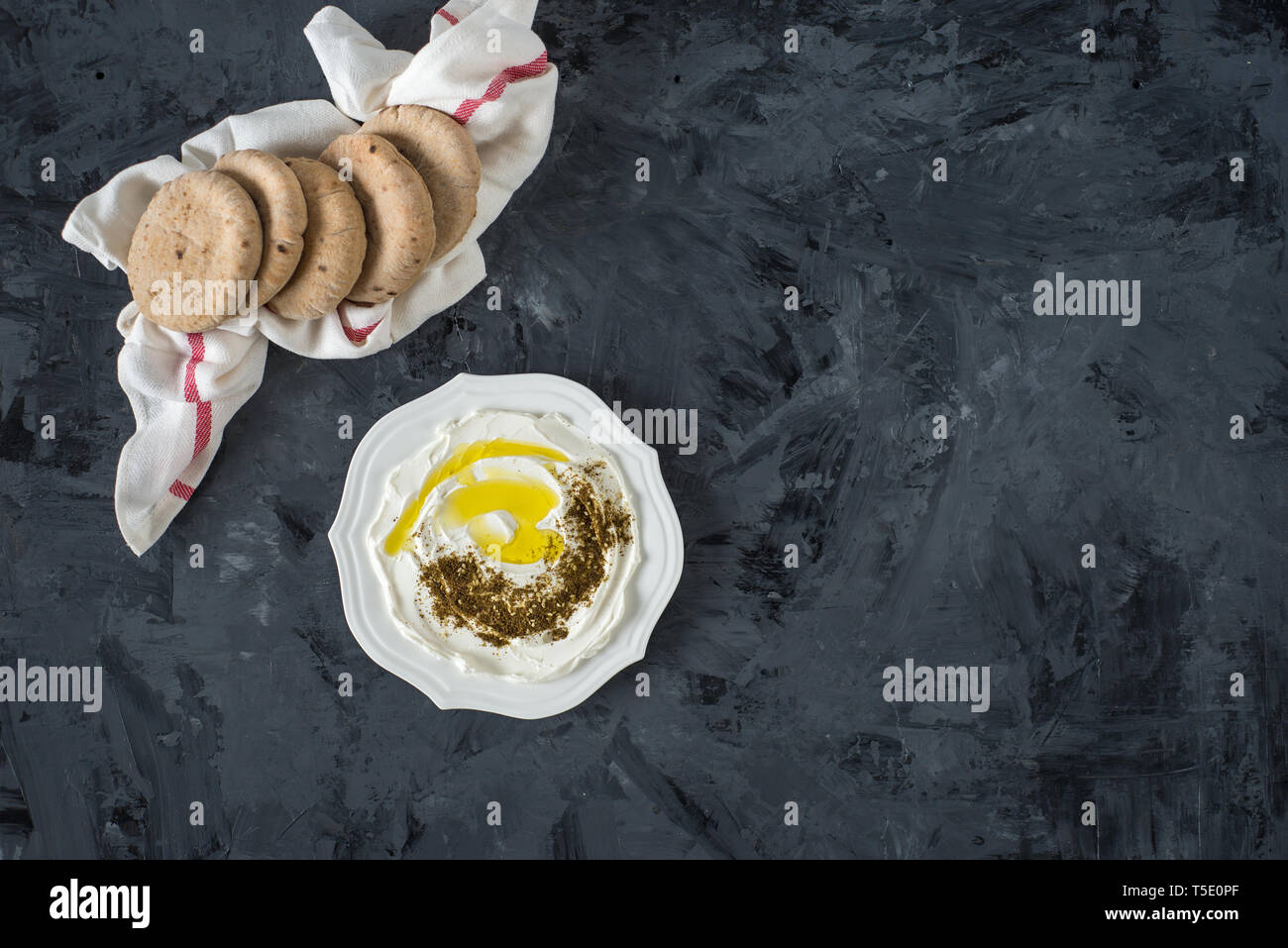 labneh (labaneh) middle eastern soft white goat's milk cheese with olive oil ,olives , za'atar