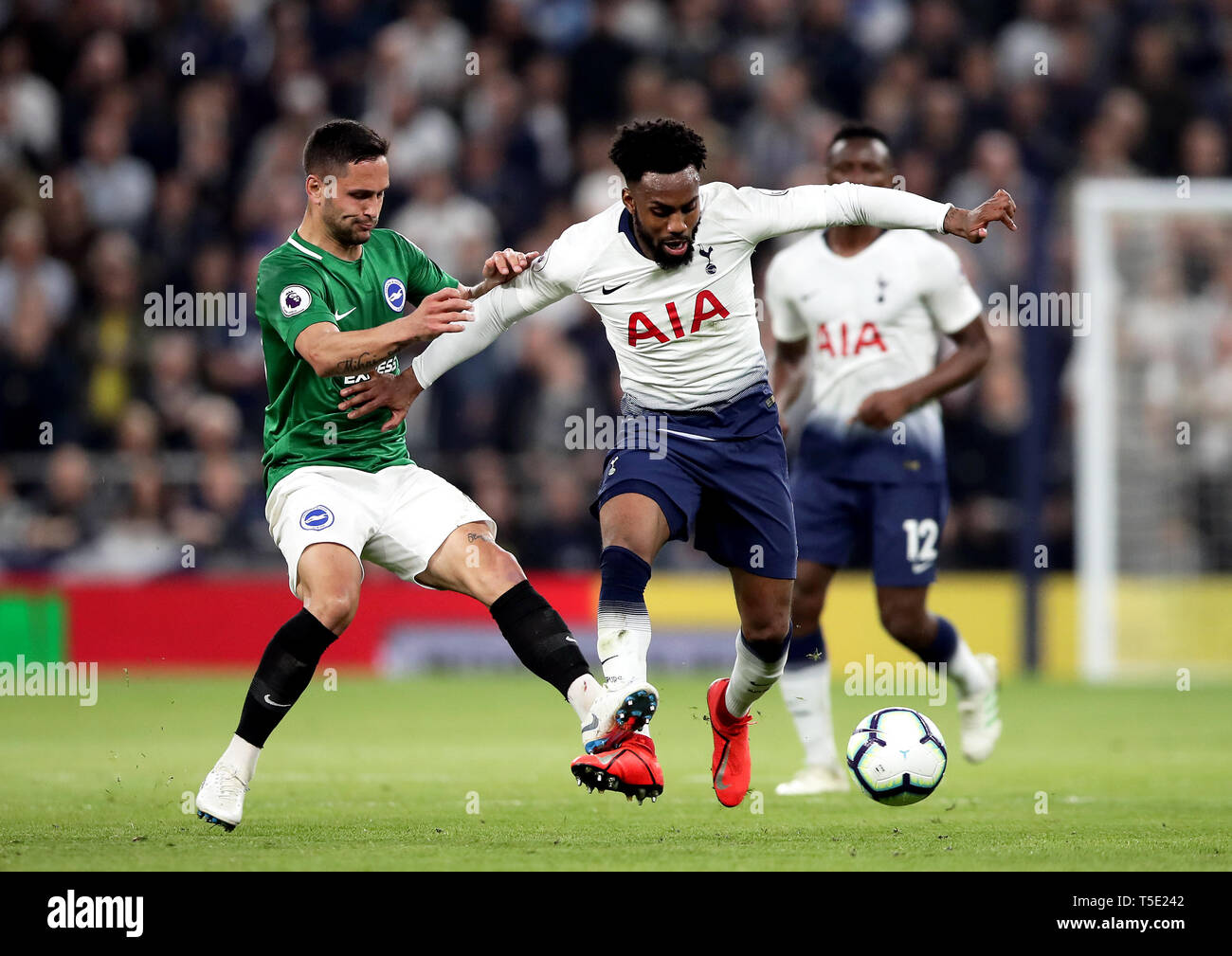 Brighton & Hove Albion's Florin Andone (left) fouls Tottenham Hotspur's ...