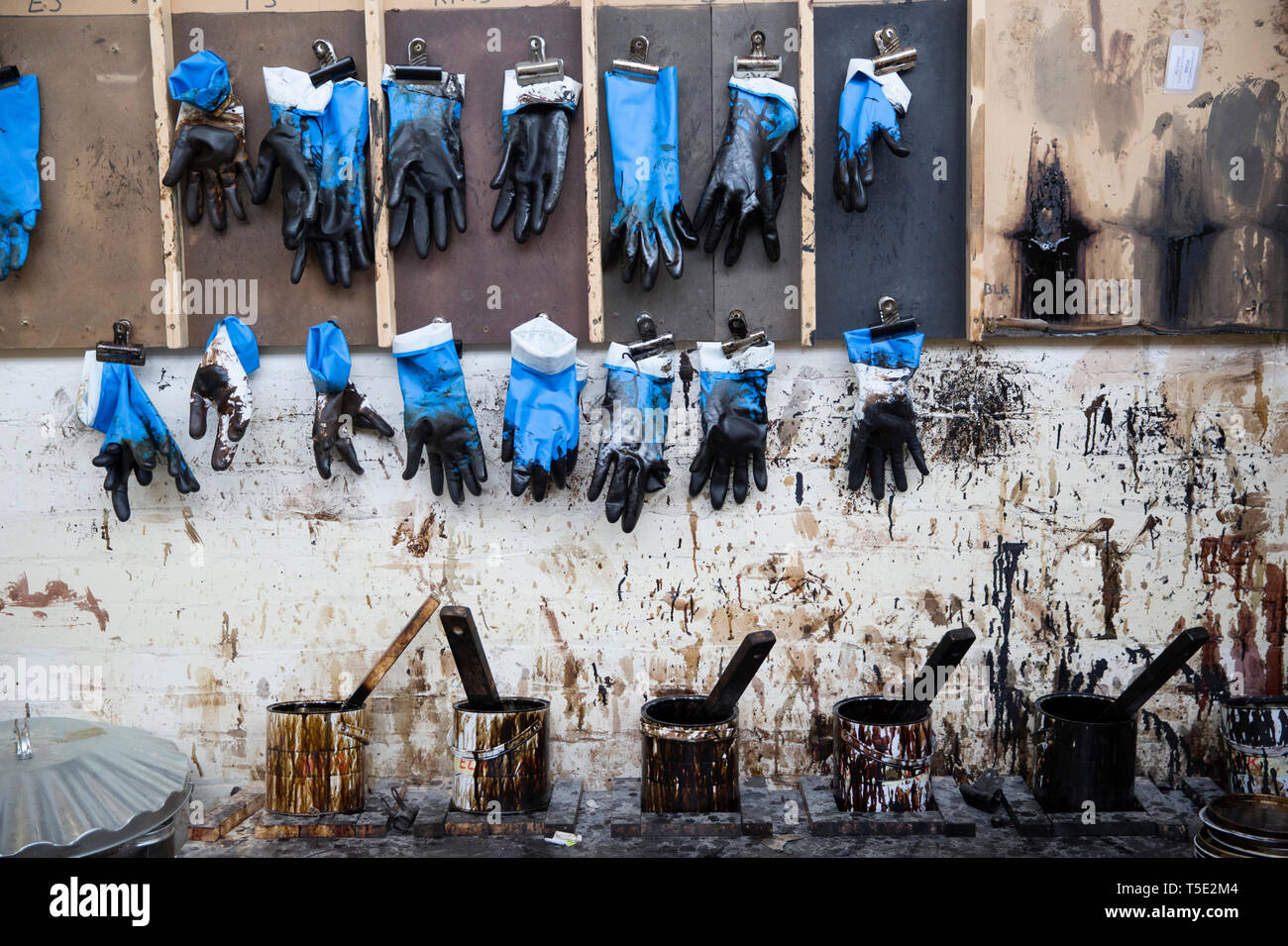 wood staining bench and gloves Stock Photo Alamy