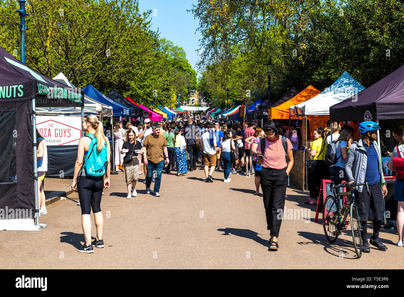 21st April 2019 - people visiting stalls at the busy Victoria Park Market during Bank Holiday heatwave, London, UK Stock Photo